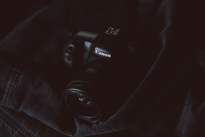 black Canon dSLR camera
